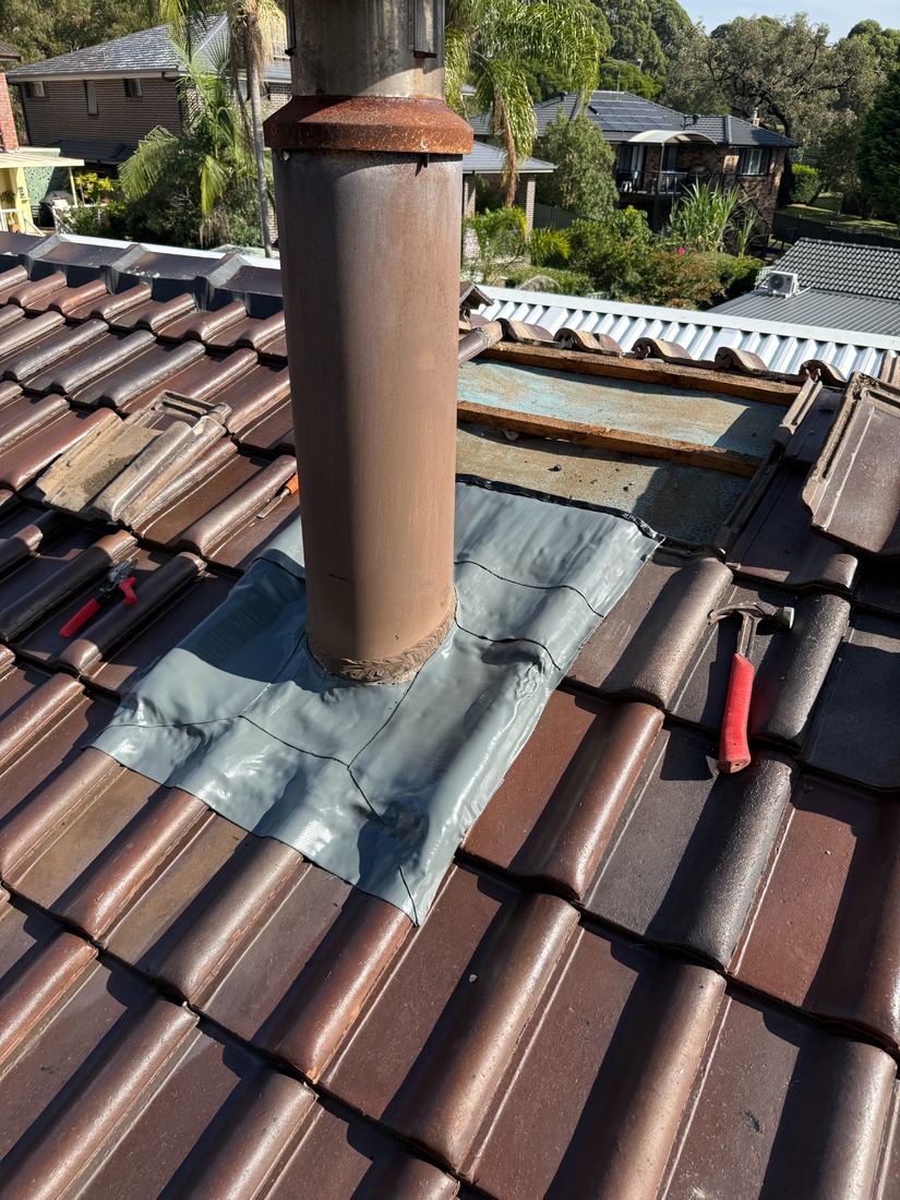 Chimney flashing repair on a tiled roof